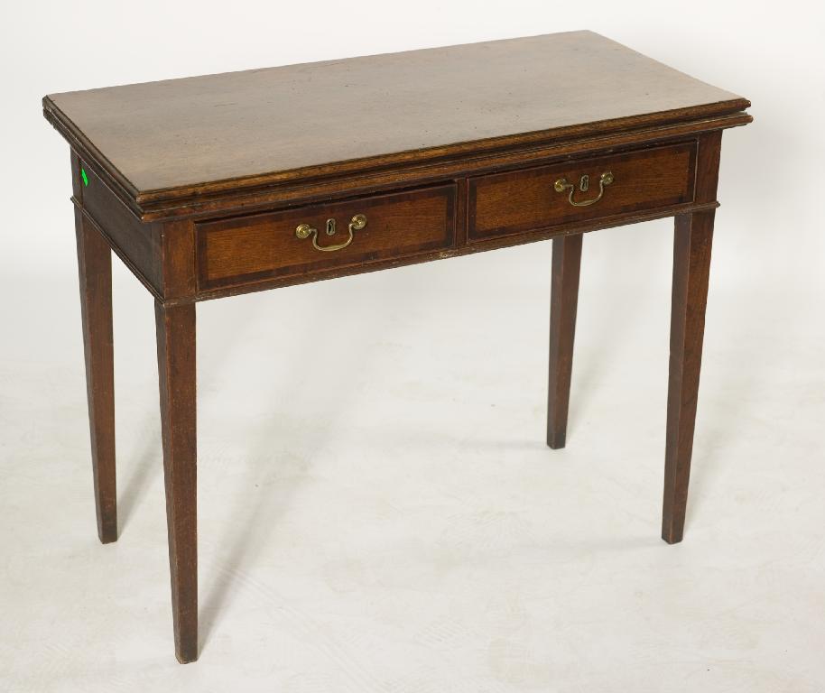 Appraisal: GEORGE III CROSS-BANDED OAK FOLDOVER TEA TABLE the moulded rectangular