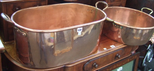 Appraisal: An oval copper fish pan with two brass handles th