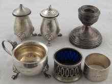 Appraisal: Silver A napkin ring a three piece cruet AF a