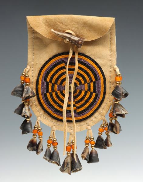 Appraisal: A TH C BEADED CARIBOU HIDE BAG WITH DEER HOOFThe