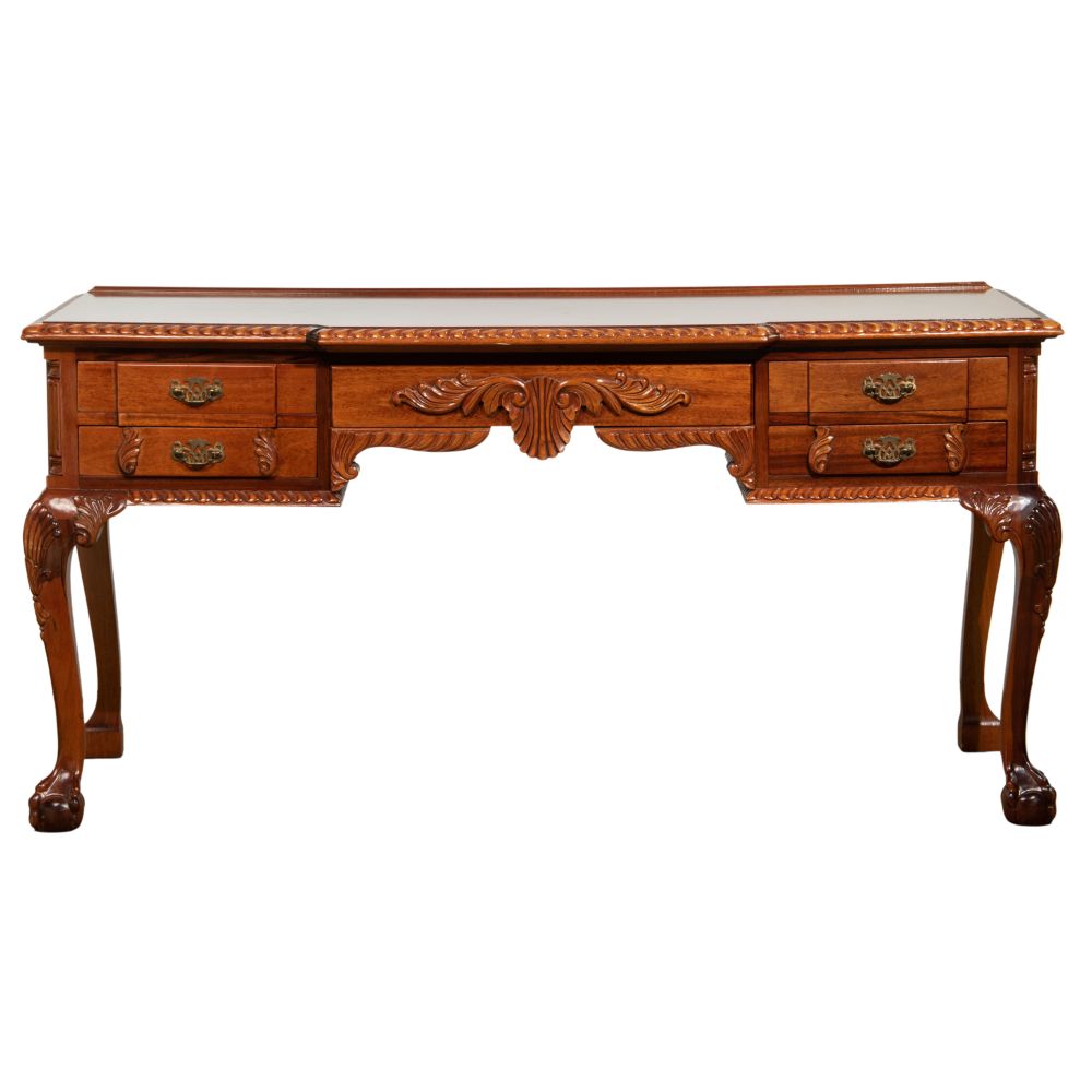 Appraisal: CARVED MAHOGANY DESKHaving a carved scroll motif claw and ball