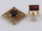 Appraisal: A yellow metal tests carat gold modernist garnet brooch with