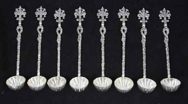 Appraisal: A set of eight plated strawberry spoons with scalloped bowls