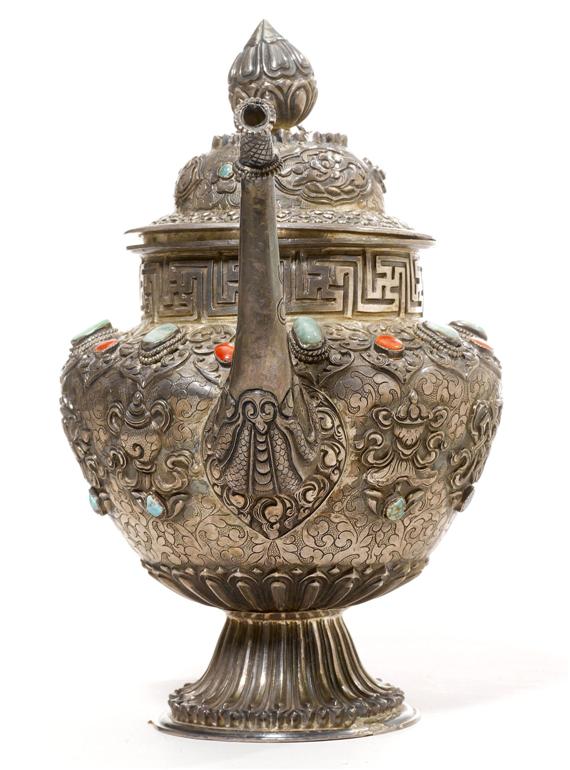 Appraisal: A SILVER TEA POT Tibet height cm Embossed engraved and