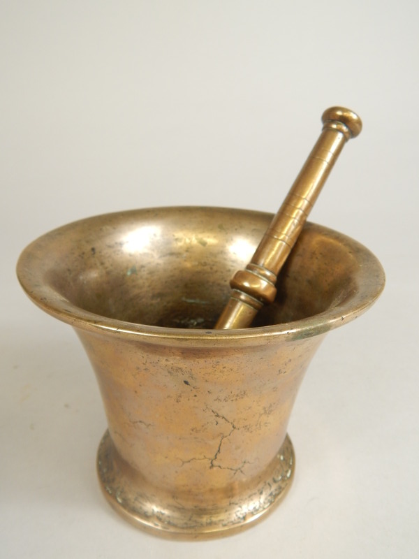 Appraisal: An thC bronze pestle and mortar of tapering form cm