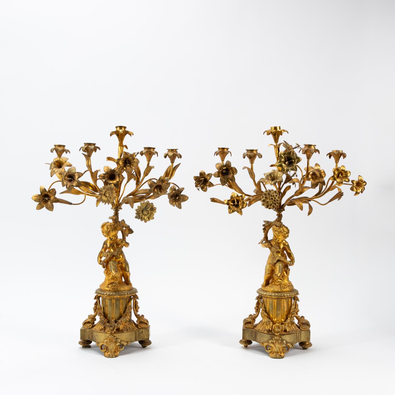 Appraisal: PR TH C FRENCH FIVE-LIGHT PUTTI CANDELABRA French th century