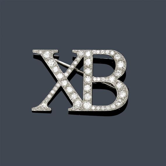 Appraisal: A DIAMOND BROOCH XB White gold Elegant brooch modeled as