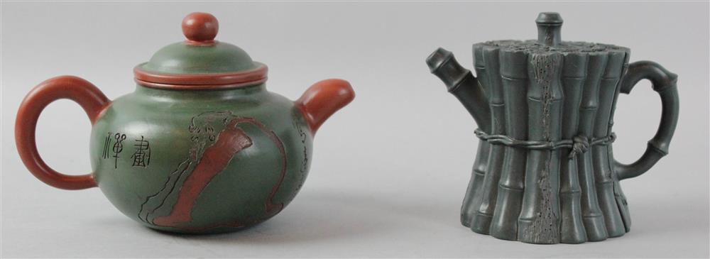 Appraisal: TWO CHINESE YIXING TEAPOTS the first of black colored clay