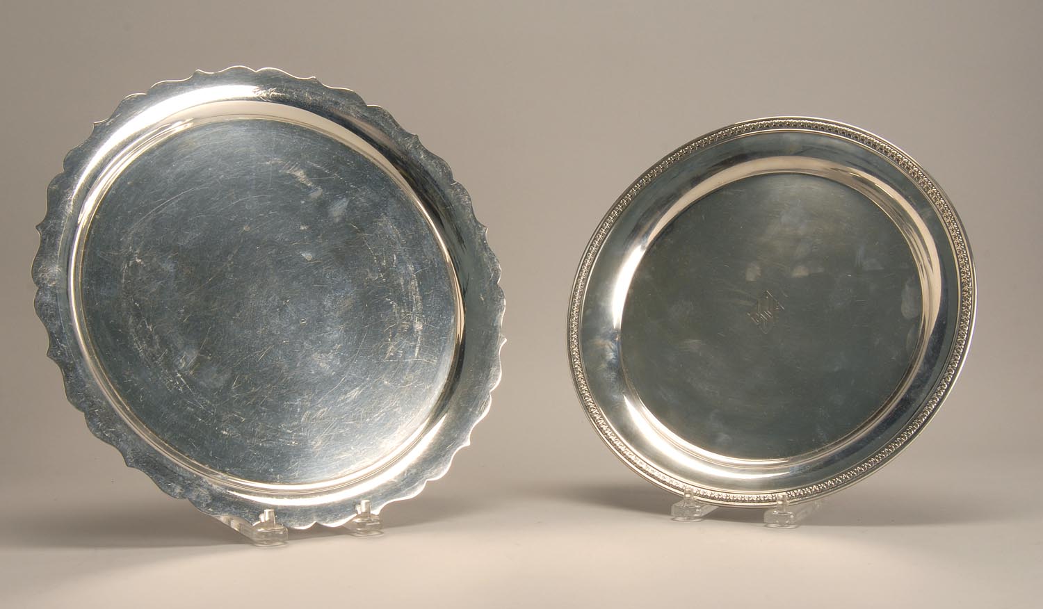 Appraisal: TWO STERLING SILVER CIRCULAR TRAYS A Tiffany tray with shaped