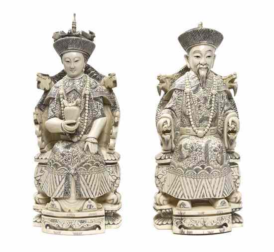 Appraisal: A Chinese Carved Ivory Emperor and Empress each figure depicted