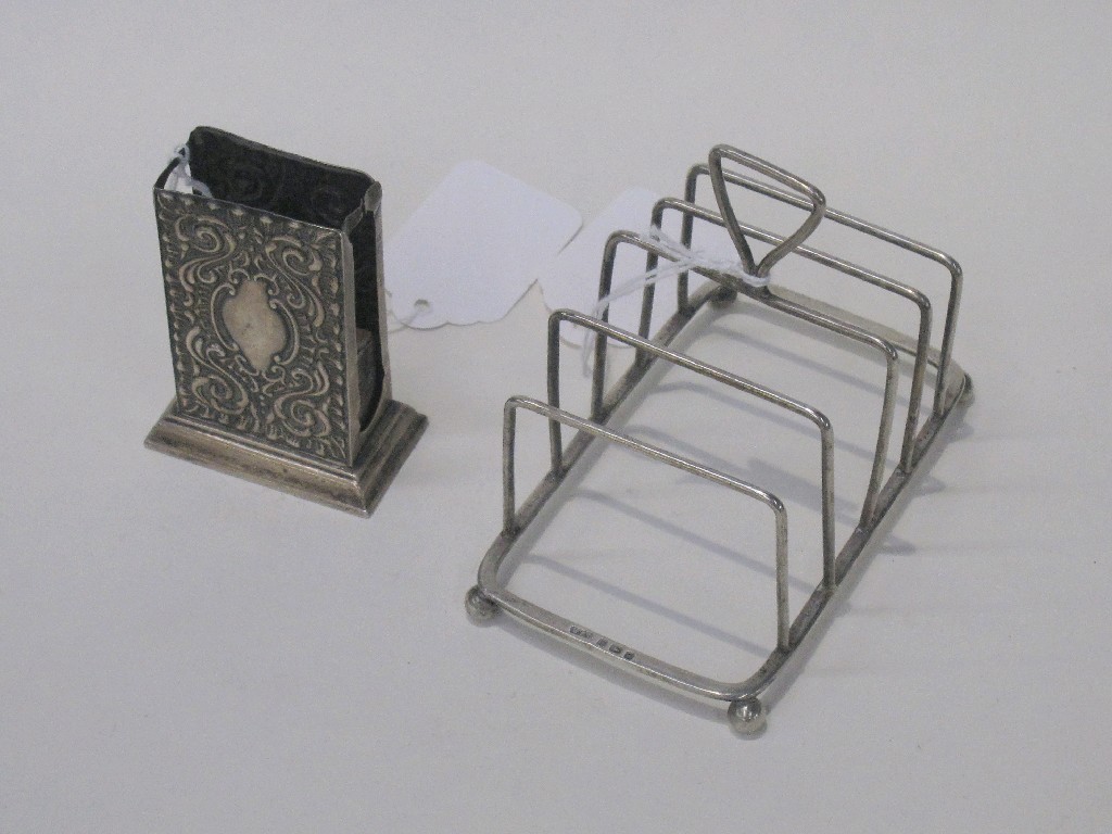 Appraisal: Lot comprising silver toastrack and matchbox holder Birmingham