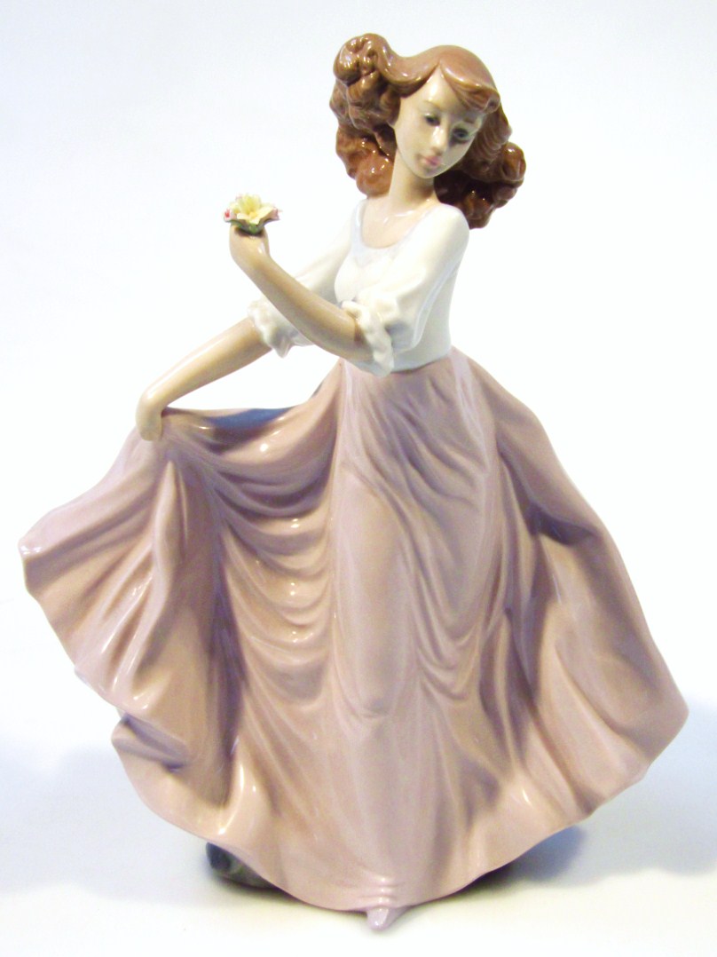 Appraisal: A Lladro porcelain figure of a lady holding a posy