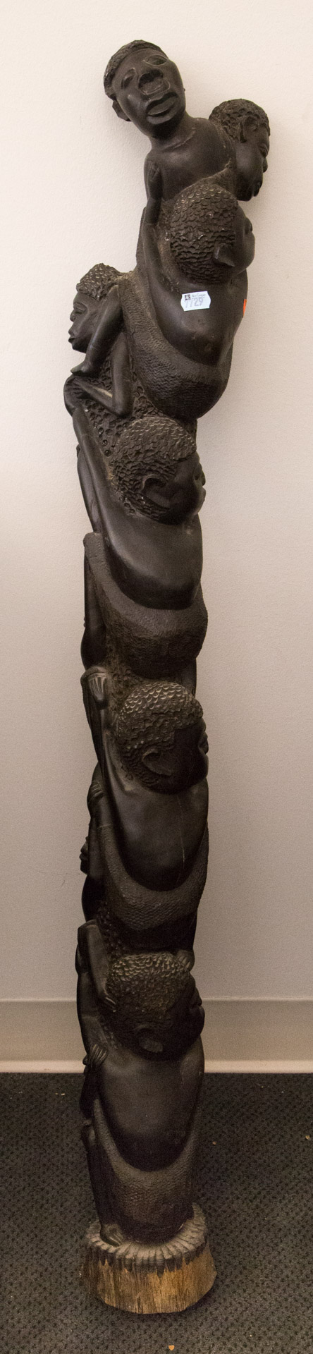 Appraisal: African carved hardwood figural post post carved as multiple climbing