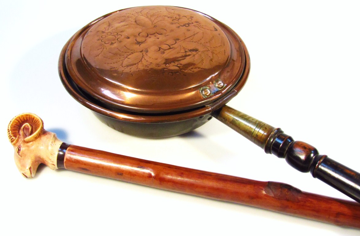 Appraisal: A thC walking cane with heavy cylindrical stem headed by