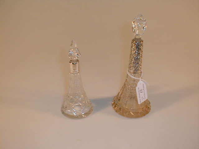 Appraisal: A conical dressing table perfume bottle with deep silver collar