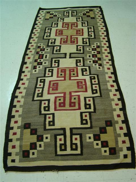 Appraisal: NAVAJO RED AND BROWN RUNNER With geometric pattern in red