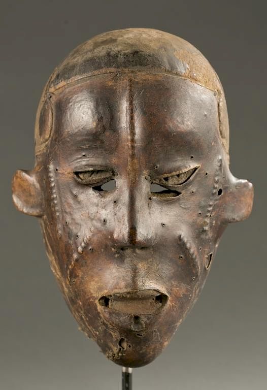 Appraisal: West African skin covered face mask th c A skin