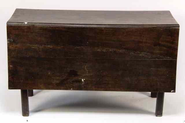 Appraisal: A George III oak two-flap table on square section legs