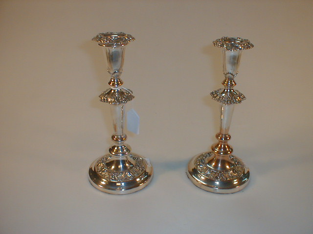 Appraisal: A pair of electroplate table candlesticks cast with fruiting vine