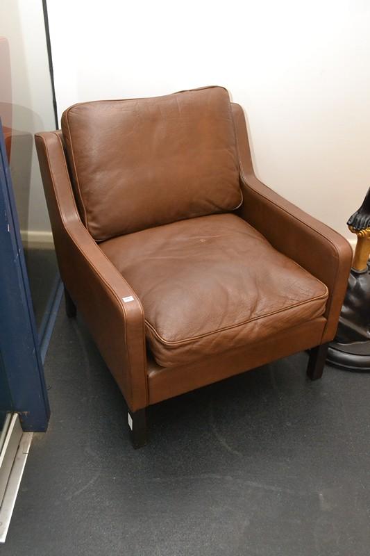 Appraisal: A DANISH LEATHER ARMCHAIR IN BROWN A DANISH LEATHER ARMCHAIR