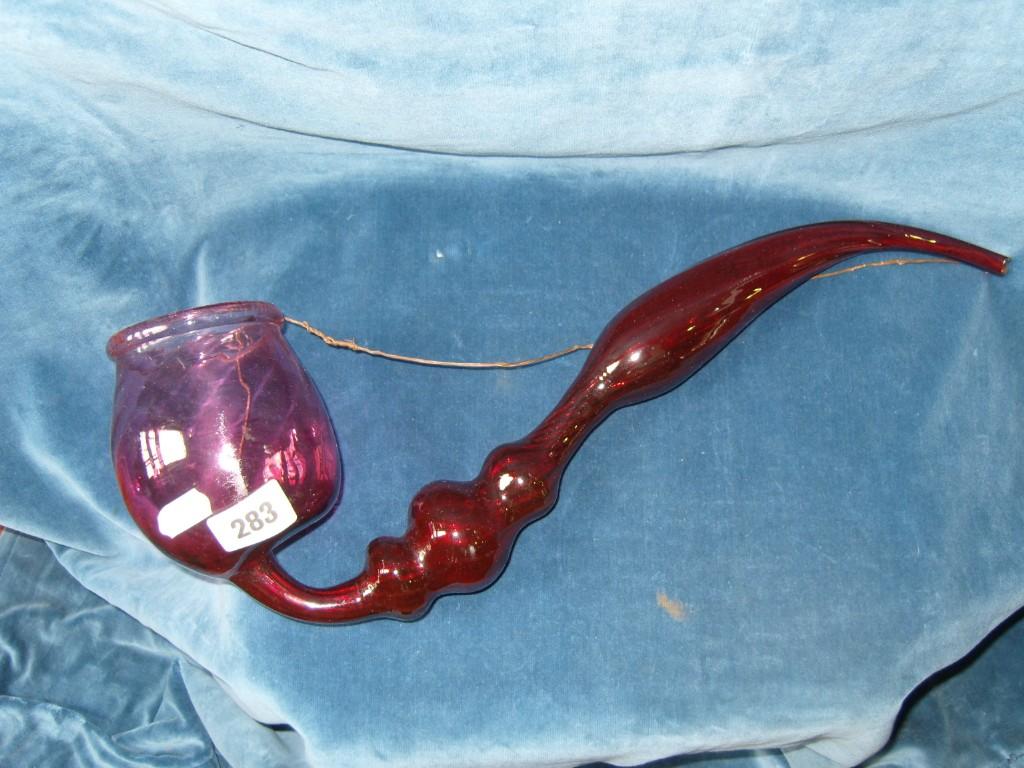 Appraisal: A th century ruby coloured glass Nailsea outsize pipe -