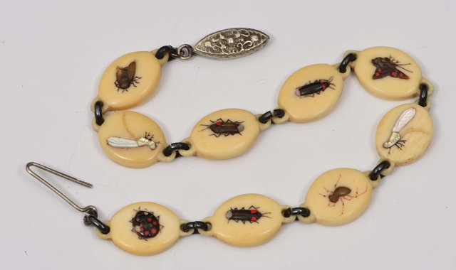 Appraisal: A Japanese ivory braceletMeiji periodformed of nine ivory miniature oval