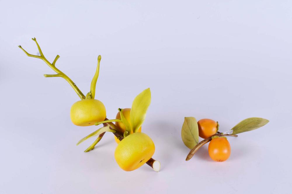 Appraisal: CHINESE CARVED ORANGE BRANCH A PERSIMMON BRANCHBoth signed Both brightly