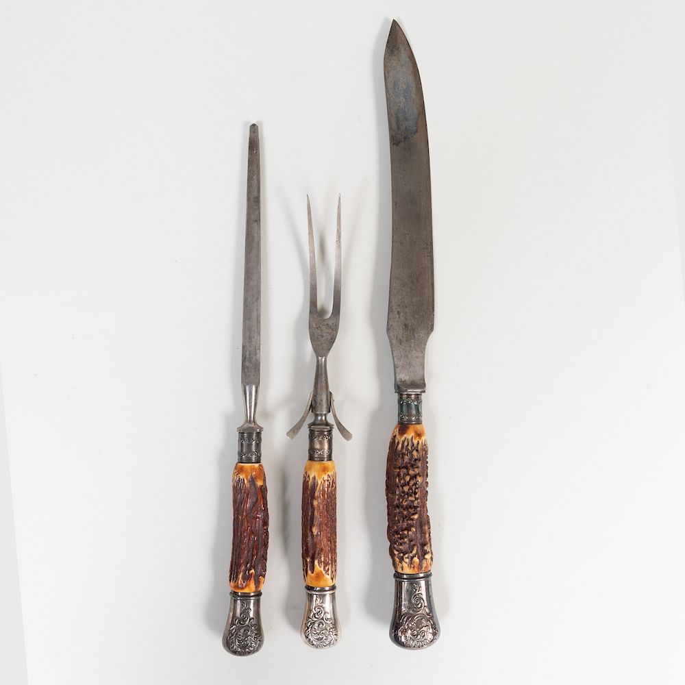 Appraisal: Horn Mounted Carving Set Comprising A knife A fork A