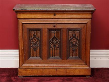 Appraisal: CHARLES X OAK MARBLE-TOP COMMODE IN THE GOTHIC TASTE The