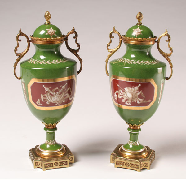 Appraisal: Pair continental hand painted porcelain urns brass trim on bodies