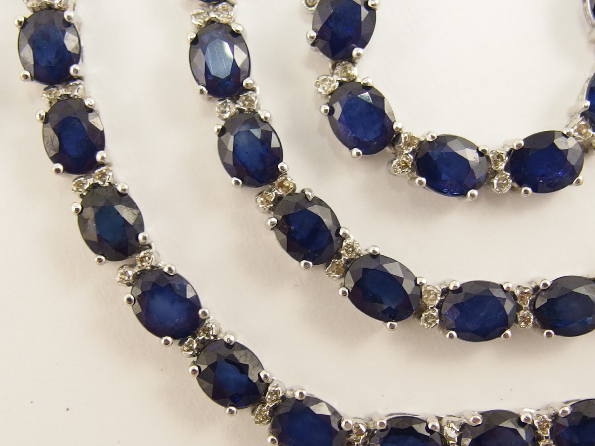 Appraisal: An ct white gold sapphire and diamond necklaceset with oval