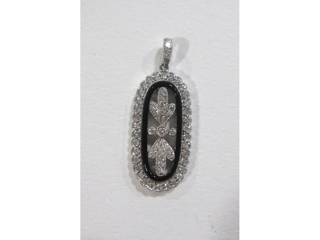 Appraisal: Eighteen carat white gold diamond and onyx set pendant