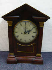 Appraisal: A large boardroom architectural mantel clock the case with tapering