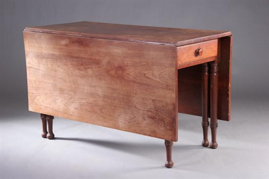 Appraisal: AMERICAN SIX-LEGGED WALNUT DROP-LEAF TABLE Early th century with original