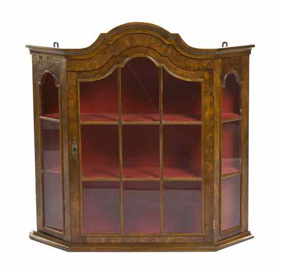 Appraisal: A Continental Burlwood Hanging Vitrine having a shaped cornice above