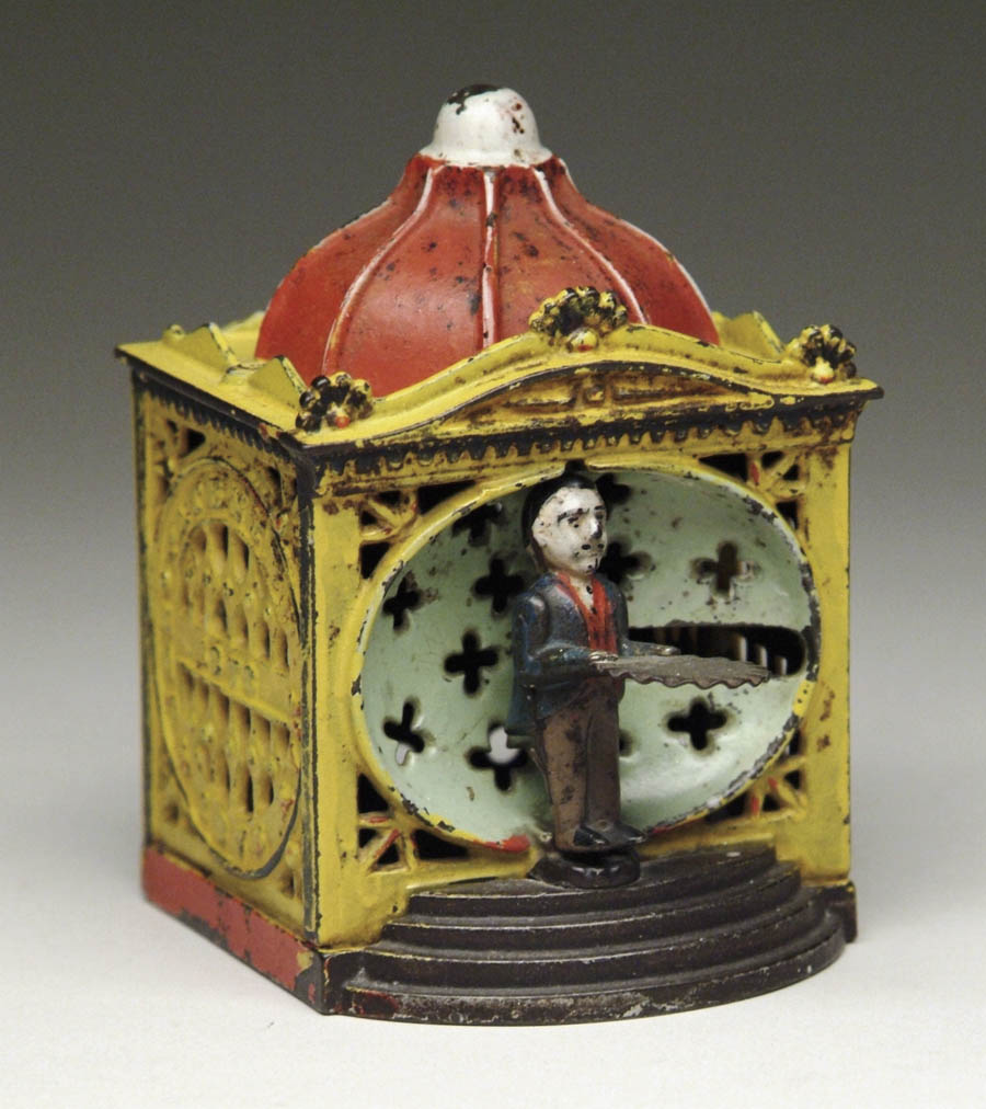 Appraisal: LILIPUT MECHANICAL BANK Bright enameled building Put coin on man's