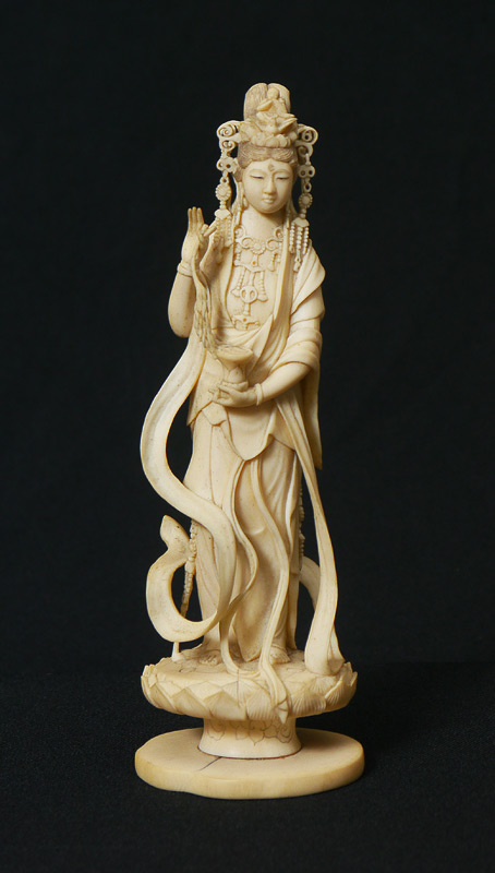 Appraisal: CARVED IVORY FIGURE OF QUAN YIN Elaborate headdress flowing robes