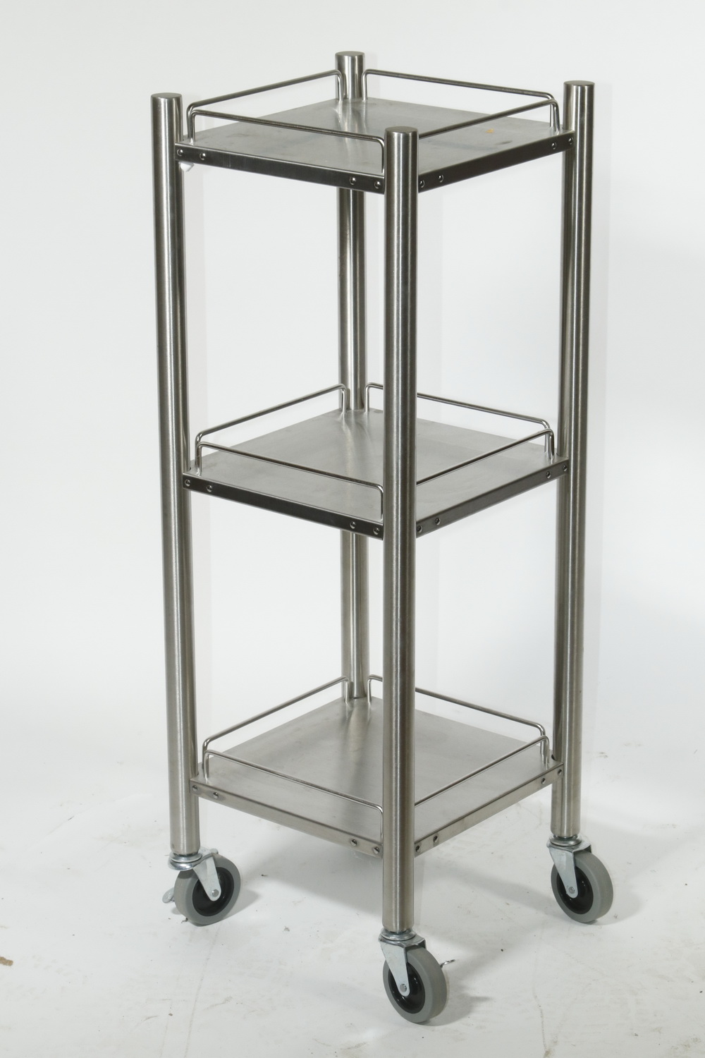 Appraisal: THREE-TIER ROLLING SHELF UNIT Three-tier brushed stainless steel diminutive rolling