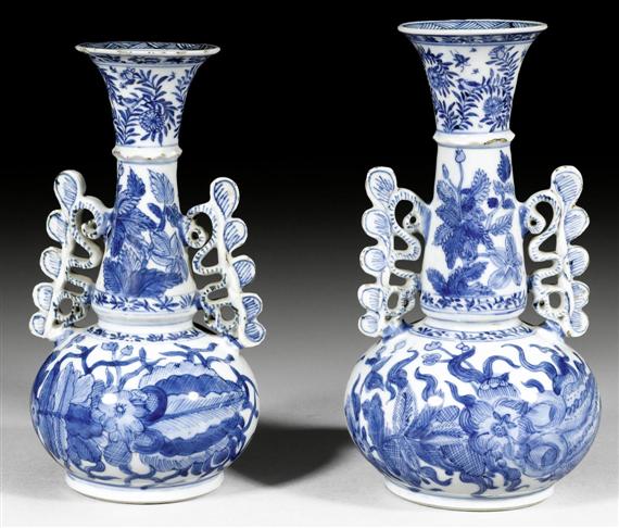 Appraisal: TWO SIMILAR BLUE AND WHITE BOTTLE VASES WITH UNUSUAL HANDLES