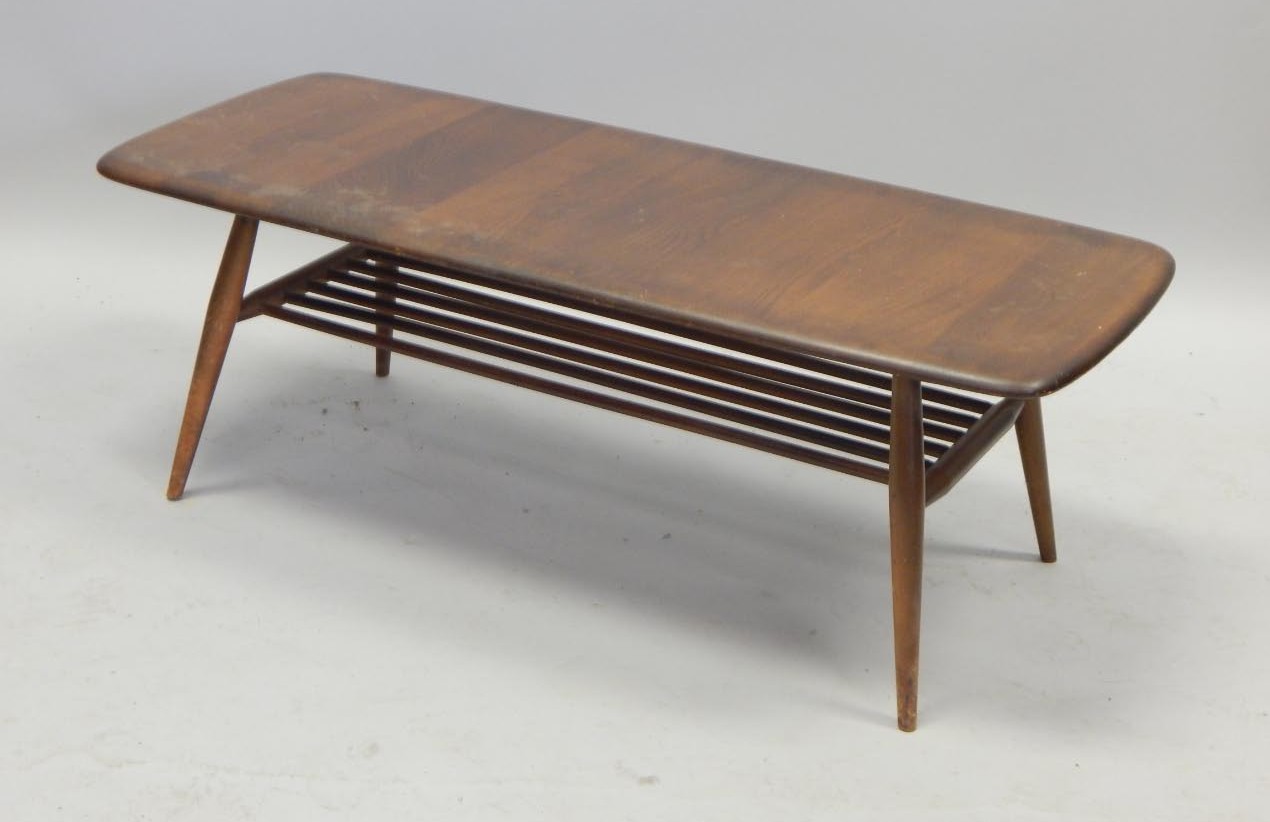 Appraisal: An Ercol mid coloured elm rectangular coffee table on turned