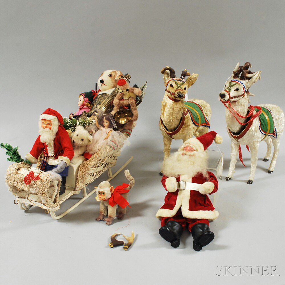 Appraisal: Small Collection of Christmas Toys a pair of clockwork wind-up