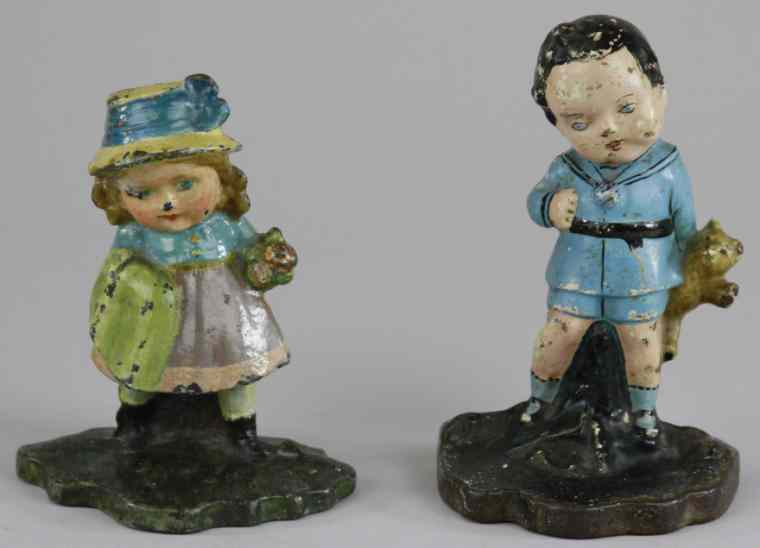 Appraisal: LOT OF TWO CHILD FIGURE DOORSTOPS Children's doorstop depicting boy