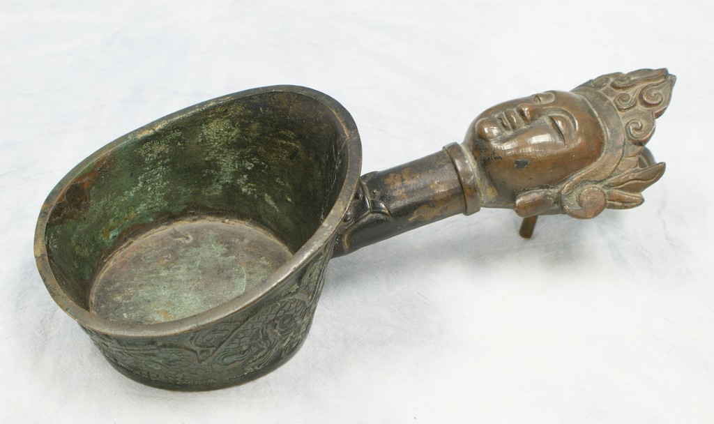 Appraisal: Chinese Charcoal Iron in brass with face in handle