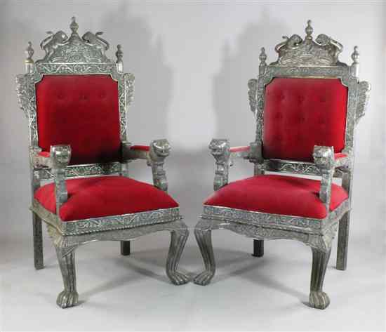 Appraisal: A pair of Indian silver overlaid throne chairs with lion