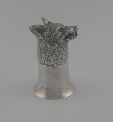 Appraisal: An Irish snarling fox mask stirrup cup with textured fur