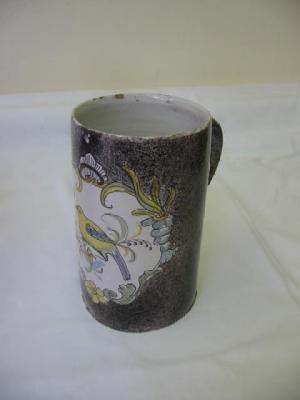 Appraisal: A MAIOLICA TANKARD of cylindrical form with loop handle painted