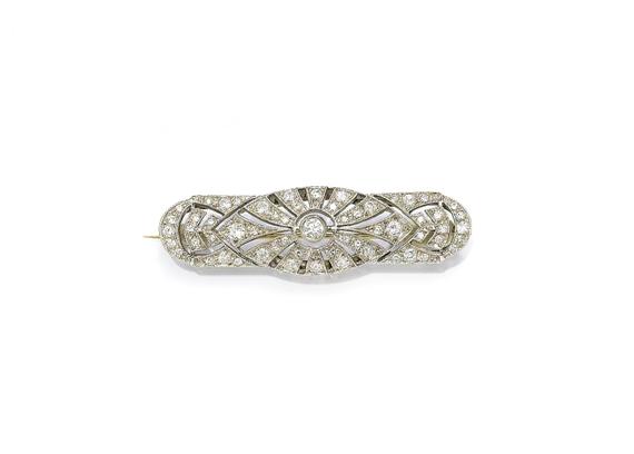 Appraisal: A DIAMOND BROOCH circa Yellow and white gold Decorative pierced