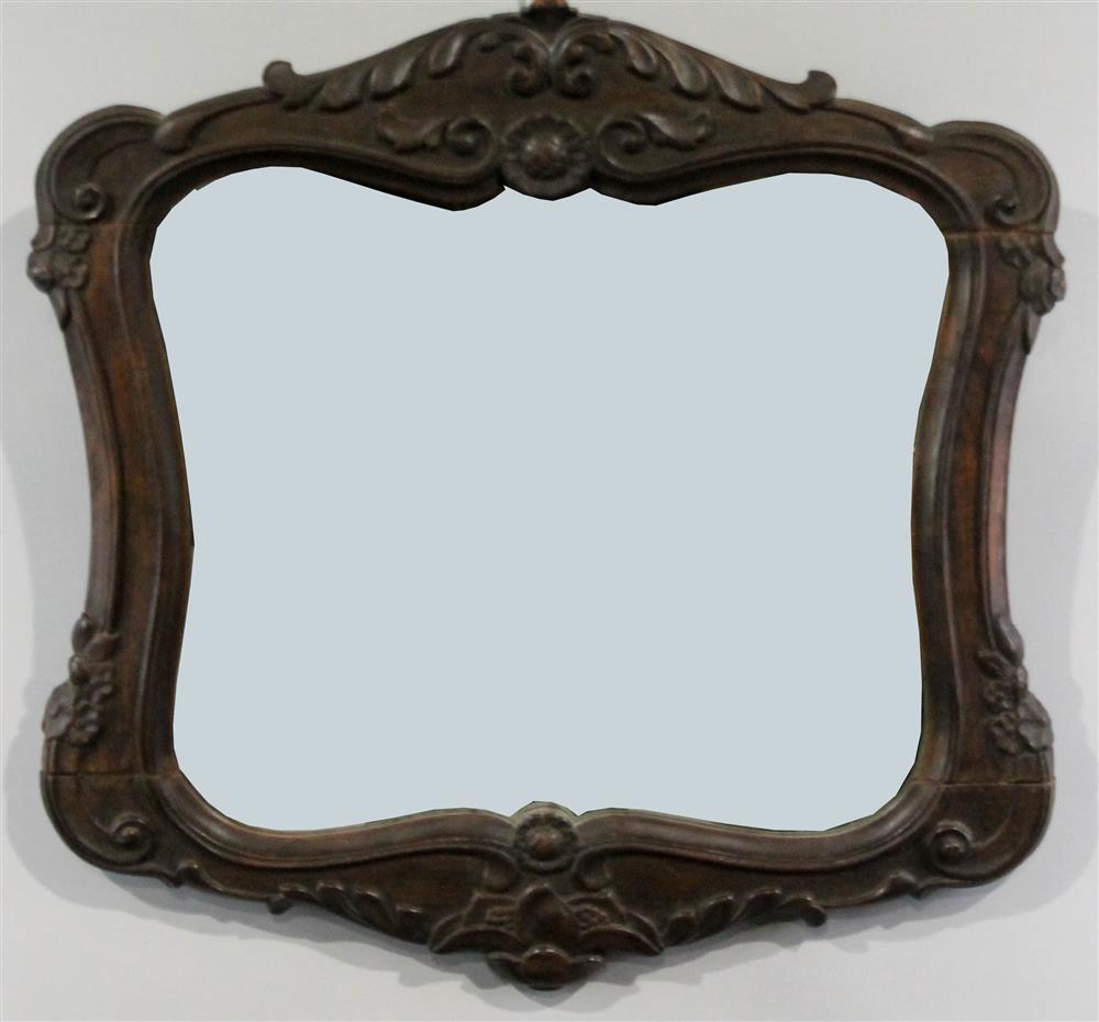 Appraisal: BAROQUE STYLE CARVED OAK MIRROR having a carved and shaped