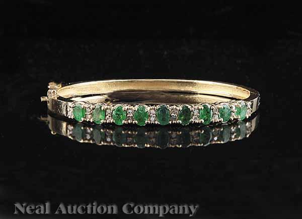 Appraisal: A kt Yellow Gold Emerald and Diamond Bangle Bracelet set