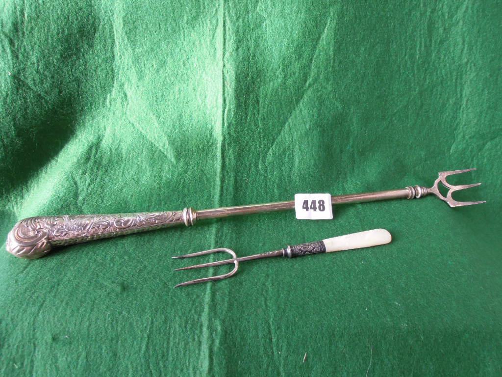 Appraisal: A Victorian telescopic toasting fork with a silver handle ending